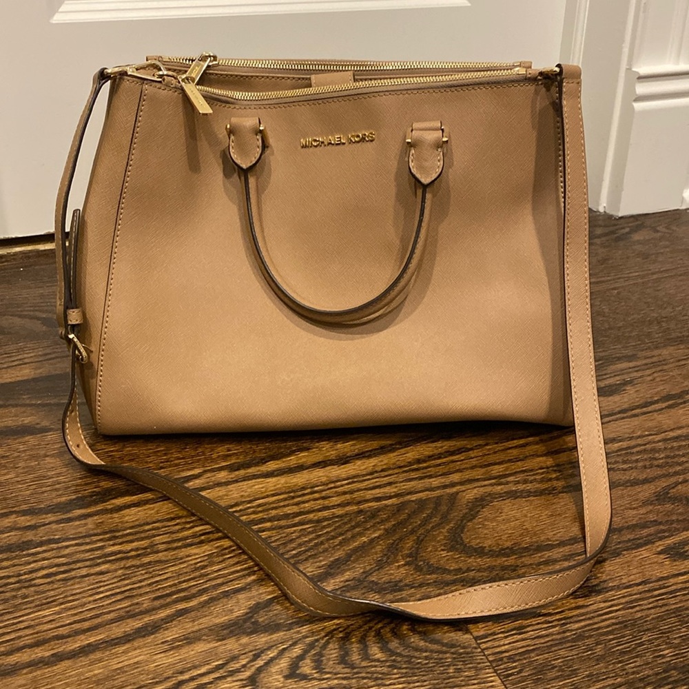 Michael Kors handbag with crossbody strap.